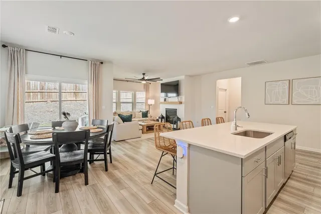 a kitchen with a sink and a large window