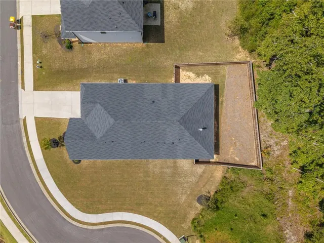 aerial view of a house with outdoor space and pool