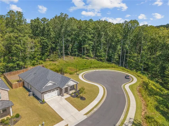 swimming pool view with a seating space