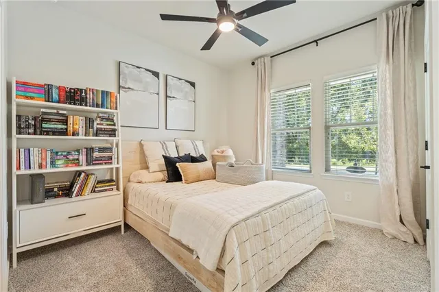 a bedroom with a bed and a book shelf