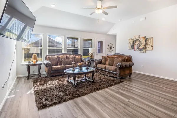 a living room with furniture and a table