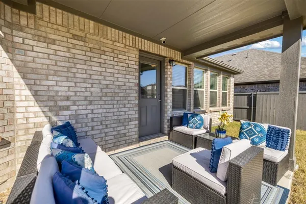 a work room with furniture and a window