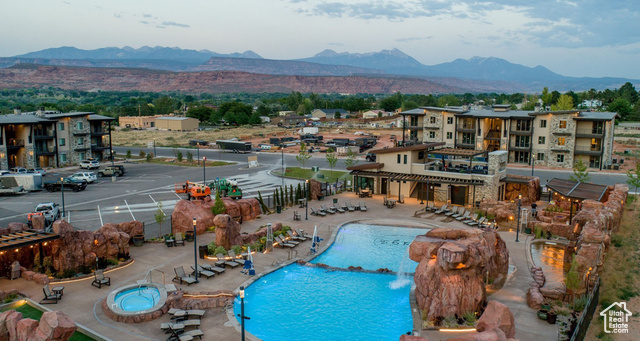 2331 Mesa Road, Unit E3 Moab, UT 84532 - Photo 46 of 71 Community pool featuring a patio, a mountain view, and a pergola