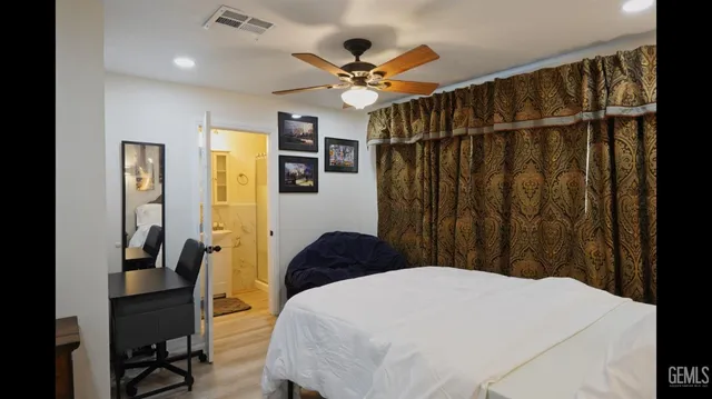 a bedroom with a bed and a walk in closet