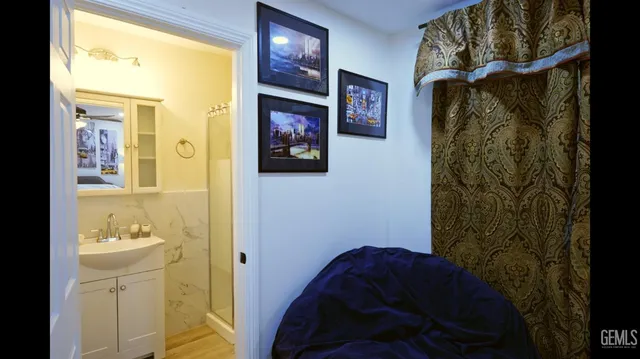 a bathroom with a glass shower door