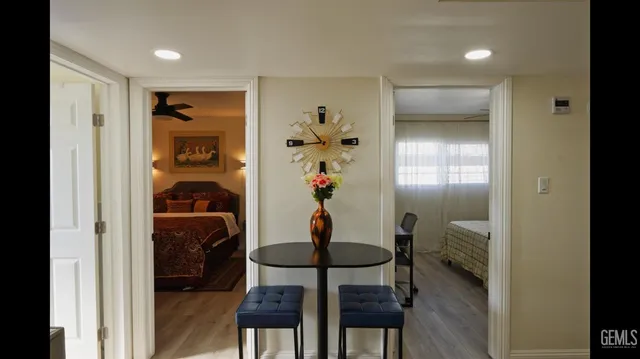 a workspace room with furniture and entryway