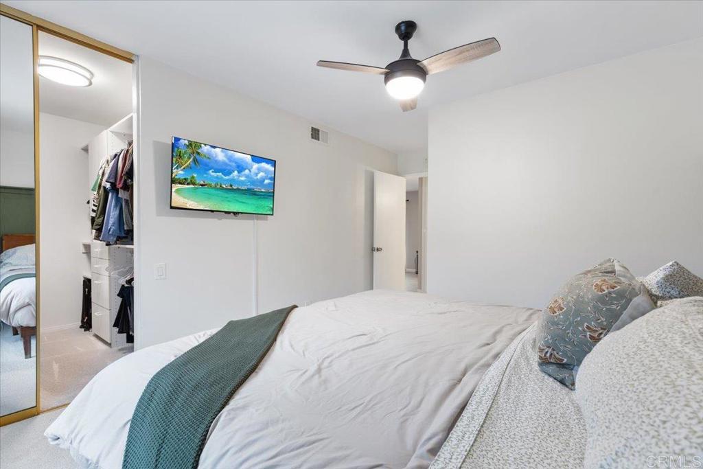 2150 Pepper Tree Place Escondido, CA 92026 - Photo 11 of 48 a bedroom with a bed and a painting on the wall