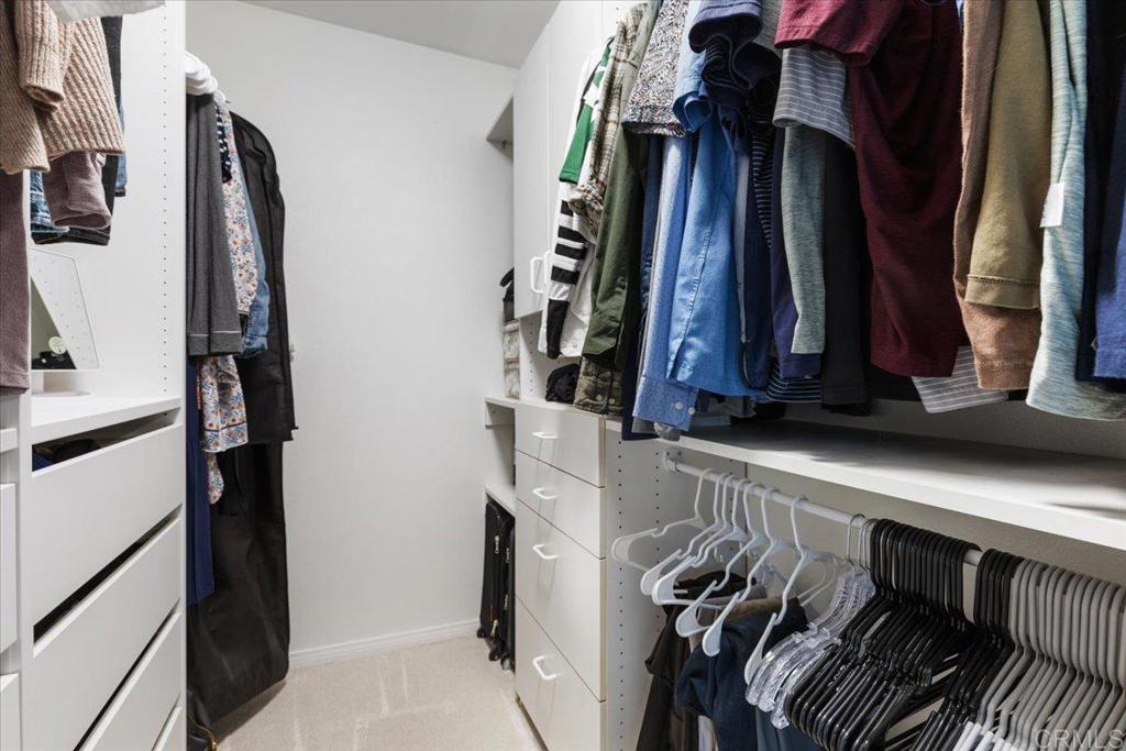 2150 Pepper Tree Place Escondido, CA 92026 - Photo 12 of 48 a view of walk in closet with clothes