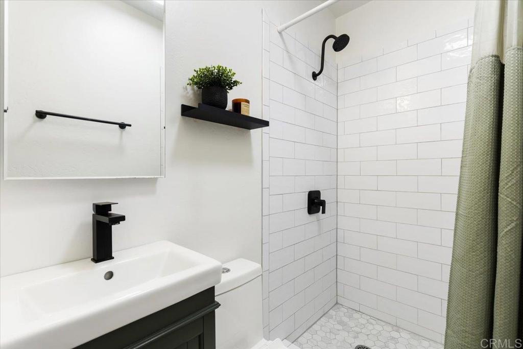 2150 Pepper Tree Place Escondido, CA 92026 - Photo 13 of 48 a bathroom with a sink and a shower
