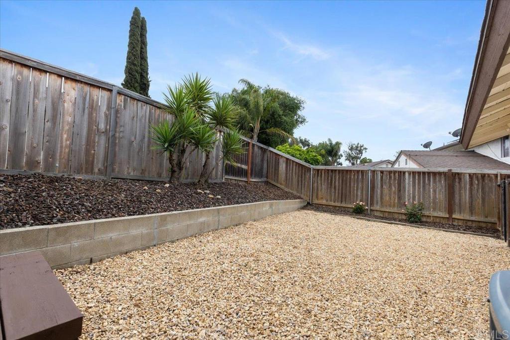 2150 Pepper Tree Place Escondido, CA 92026 - Photo 23 of 48 a view of backyard with wooden fence