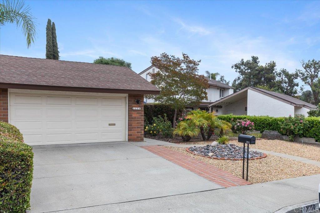 2150 Pepper Tree Place Escondido, CA 92026 - Photo 24 of 48 a front view of a house with garden