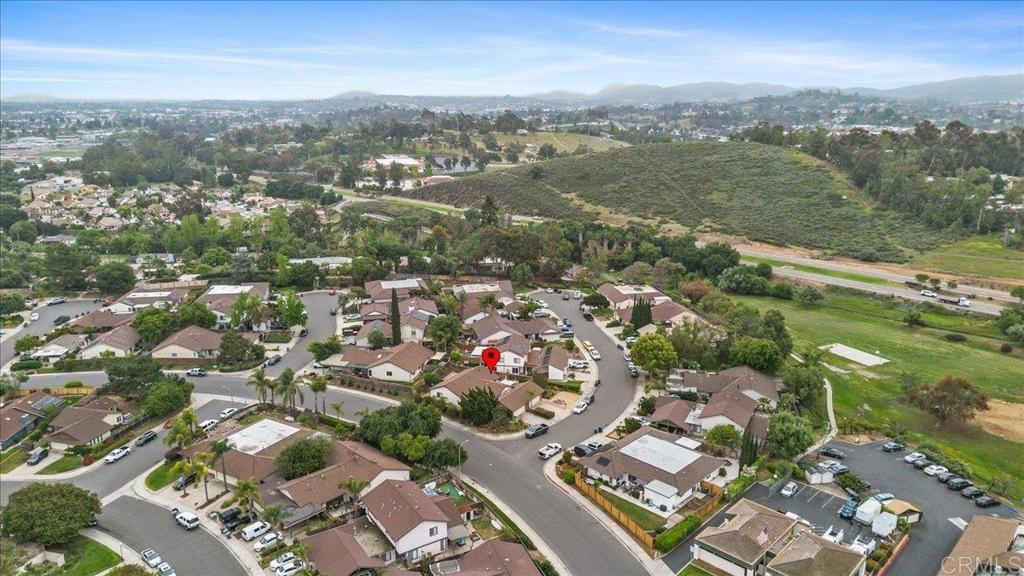 2150 Pepper Tree Place Escondido, CA 92026 - Photo 38 of 48 an aerial view of a city with lots of residential buildings