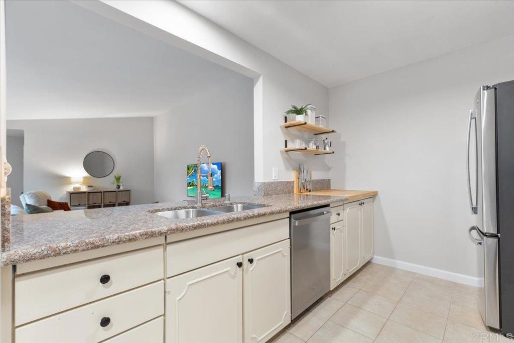 2150 Pepper Tree Place Escondido, CA 92026 - Photo 7 of 48 a bathroom with a granite countertop sink and a mirror