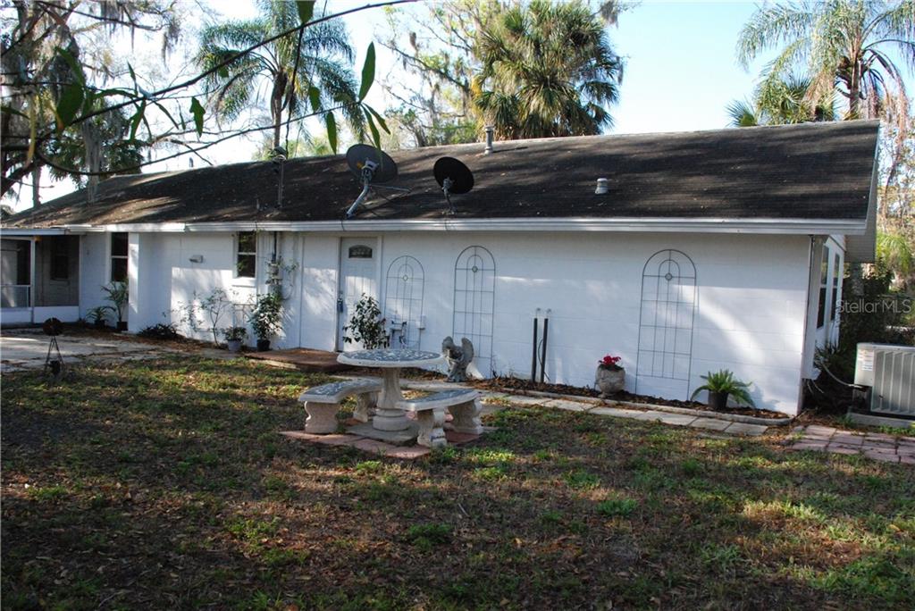 17105 Bevill Road Odessa, FL 33556 - Photo 1 of 1 a front view of house with yard