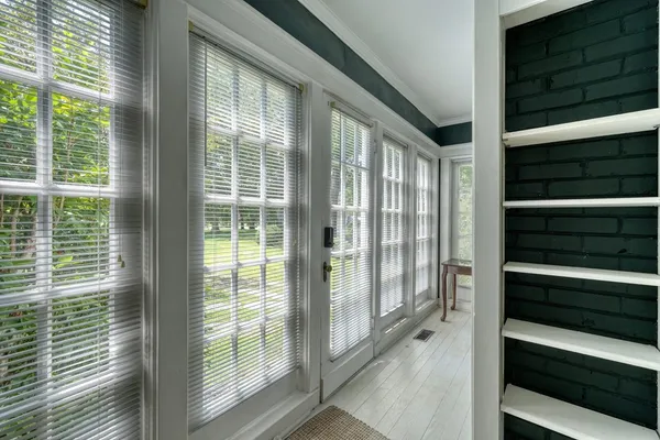 a dining room with furniture window and outside view