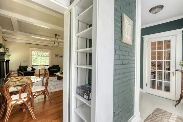 a large kitchen with stainless steel appliances kitchen island granite countertop a table and chairs
