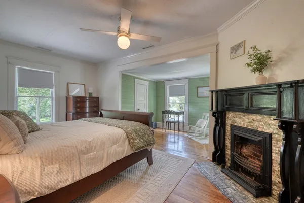 a living room with furniture and a floor to ceiling window