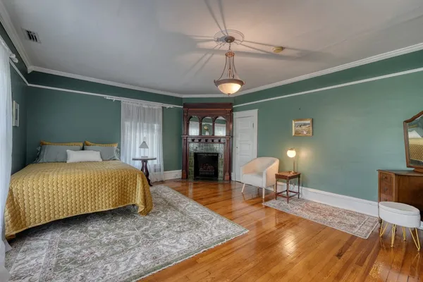 a front view of a house with a garden and plants