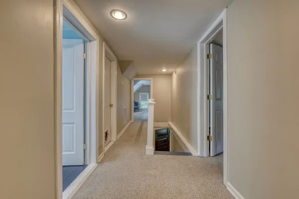 a view of a house with yard and green space