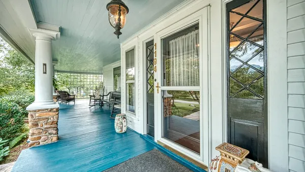 a living room with furniture a fireplace and a table