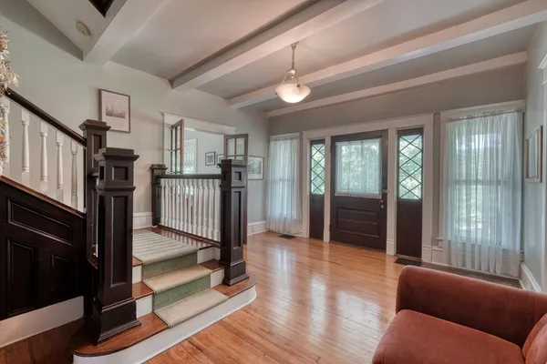 a view of a livingroom with furniture and windows