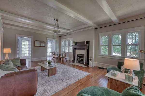 a kitchen with kitchen island white cabinets and stainless steel appliances