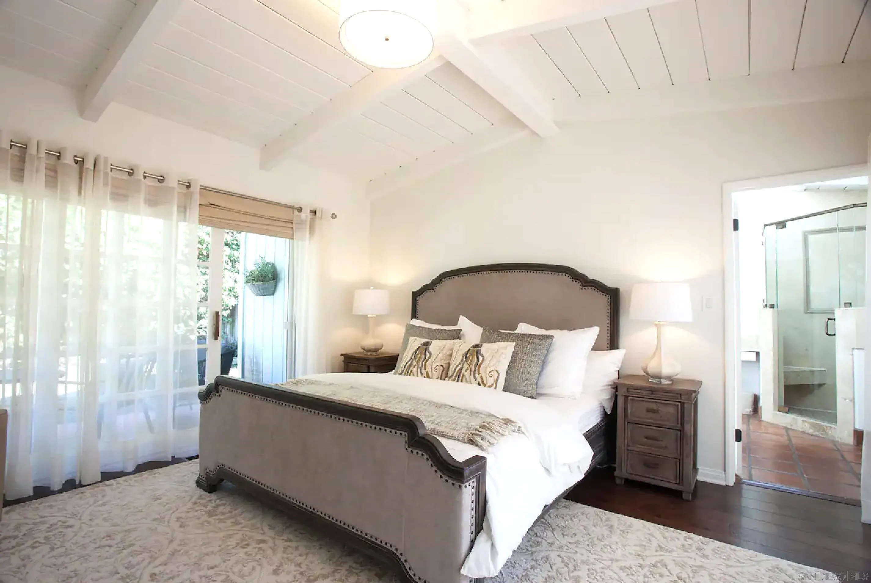 8381 El Paseo Grande La Jolla, CA 92037 - Photo 11 of 21 a bedroom with a bed and a window