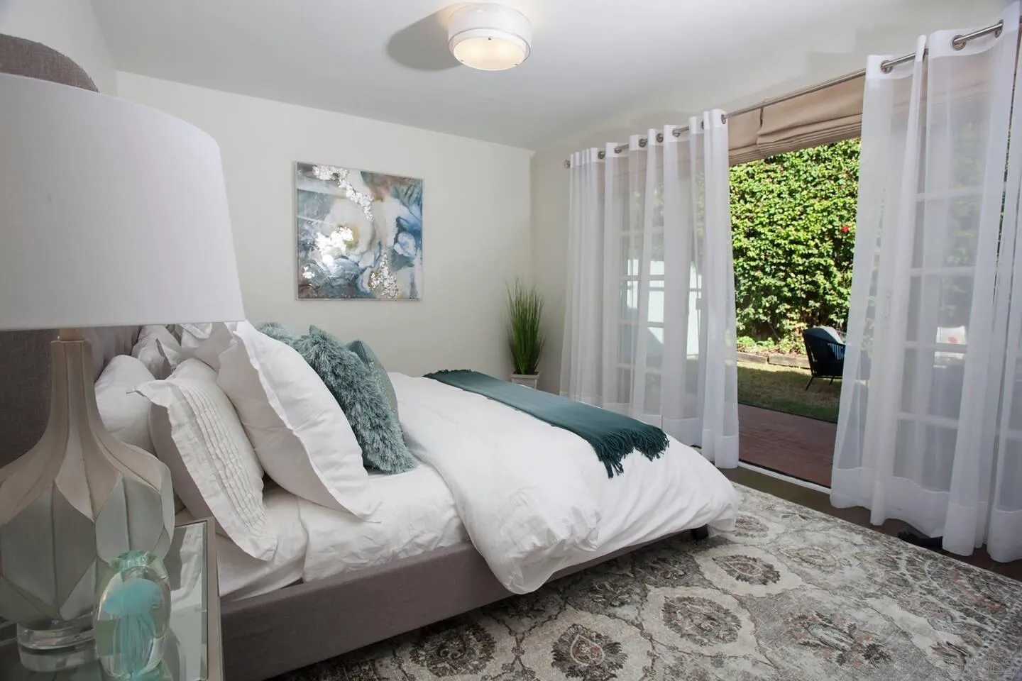 8381 El Paseo Grande La Jolla, CA 92037 - Photo 13 of 21 a bedroom with bed and a window