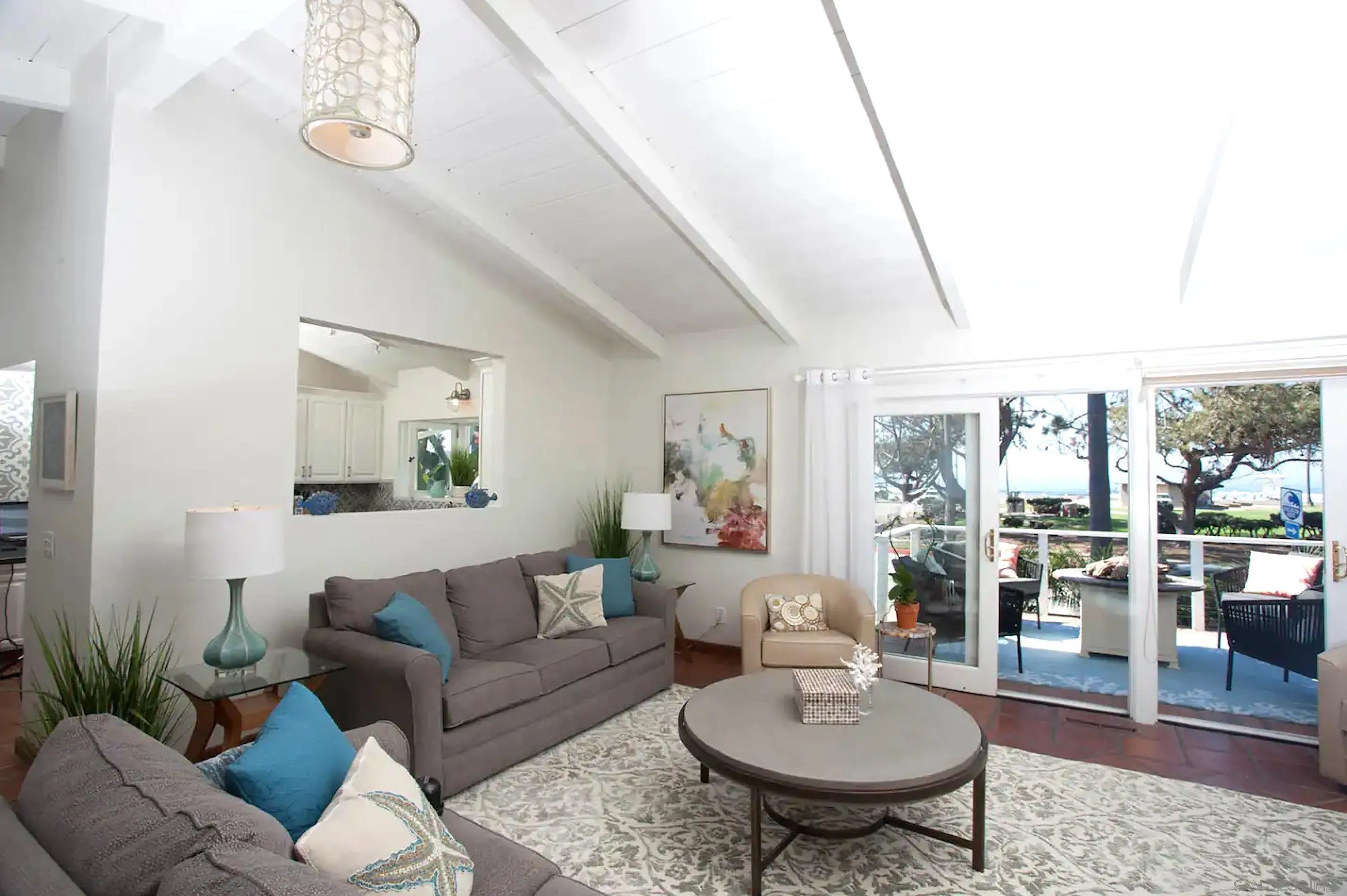 8381 El Paseo Grande La Jolla, CA 92037 - Photo 2 of 21 a living room with furniture and a wooden floor