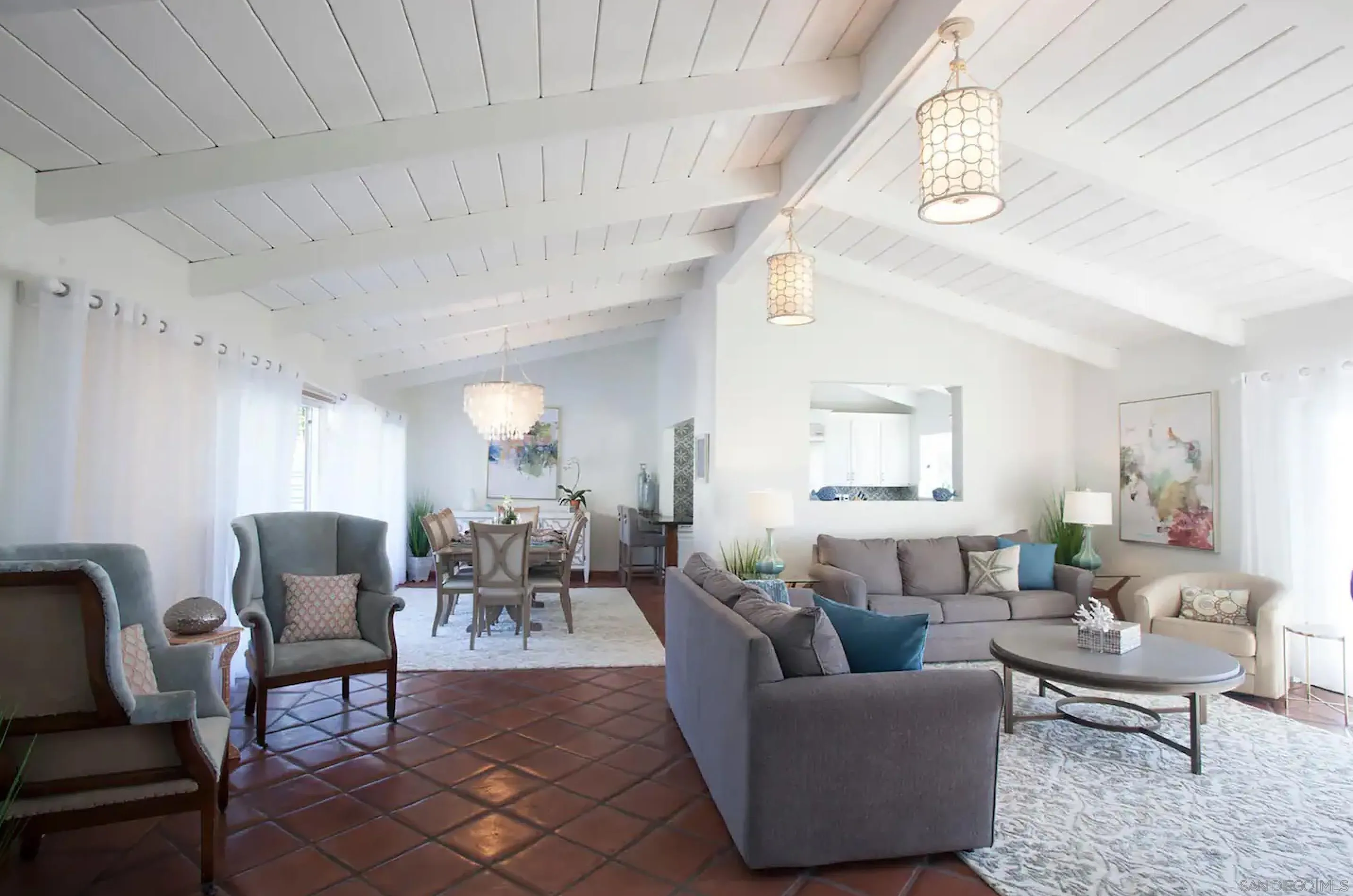 8381 El Paseo Grande La Jolla, CA 92037 - Photo 9 of 21 a living room with furniture and a chandelier