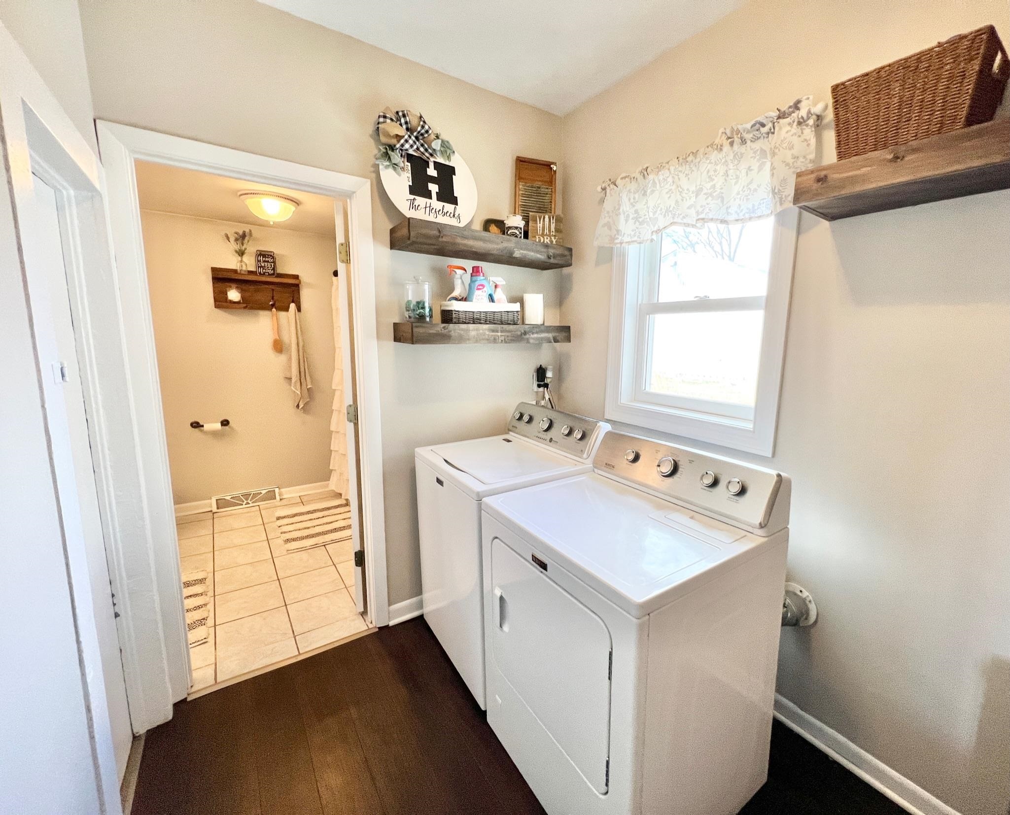 22860 Capron Road Capron, IL 61012 - Photo 27 of 39 a utility room with cabinets washer and dryer