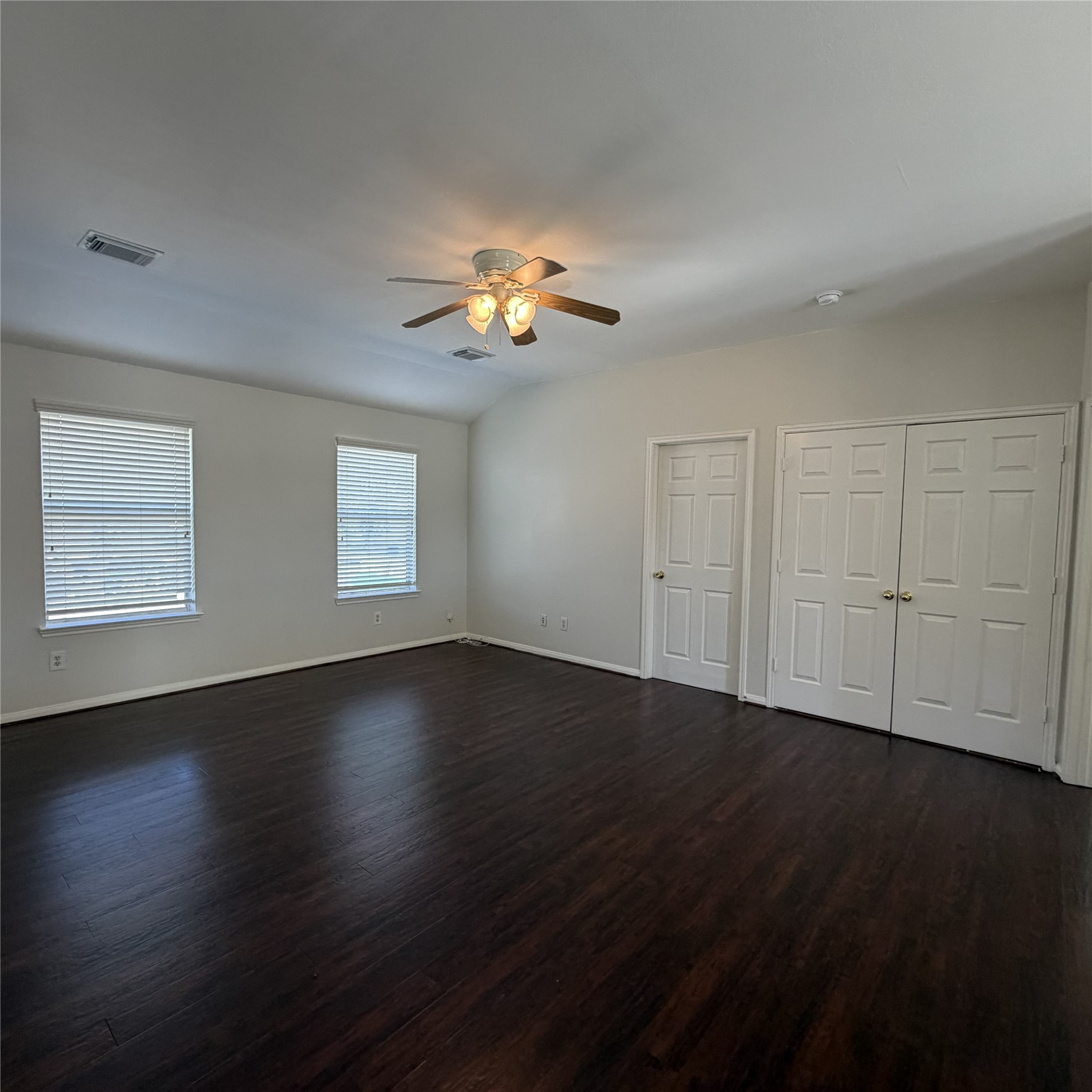 12219 Winderwick Lane Houston, TX 77066 - Photo 21 of 36 a view of an empty room with wooden floor and a window