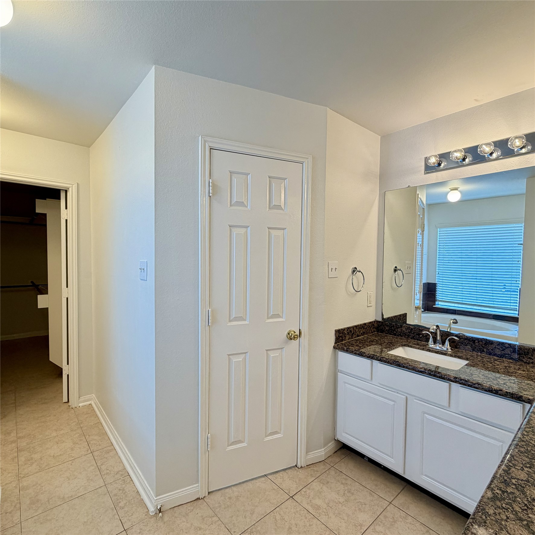 12219 Winderwick Lane Houston, TX 77066 - Photo 27 of 36 a kitchen with granite countertop white cabinets and stainless steel appliances