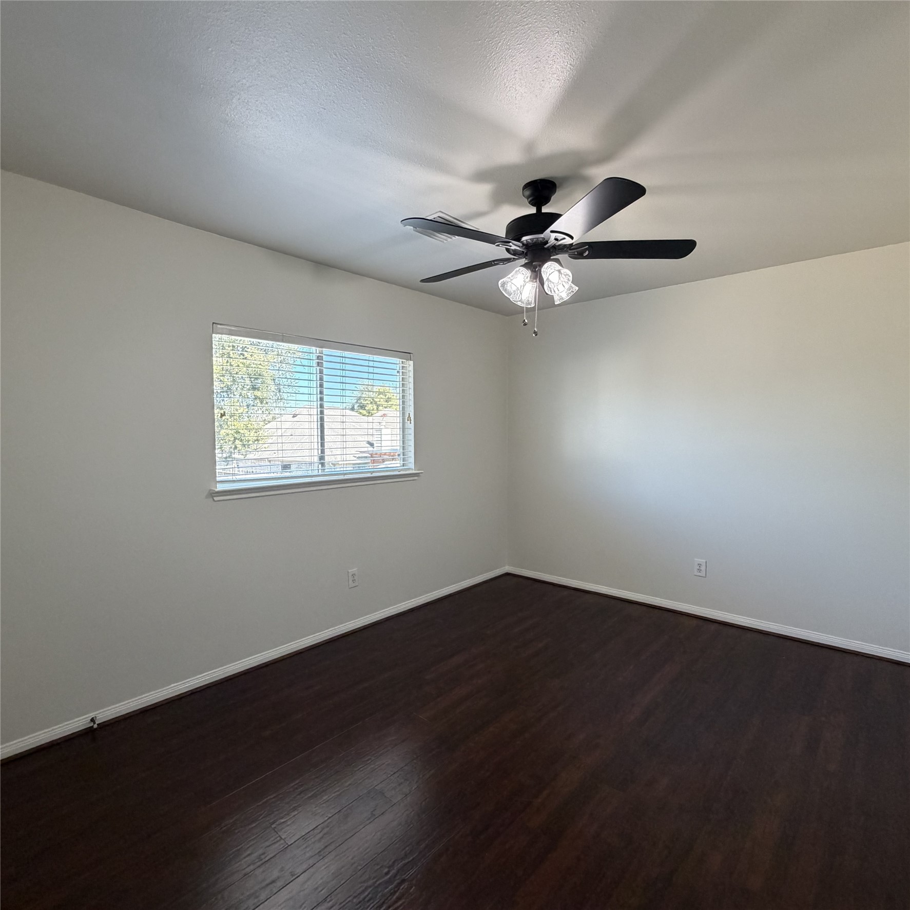 12219 Winderwick Lane Houston, TX 77066 - Photo 29 of 36 a view of an empty room with wooden floor