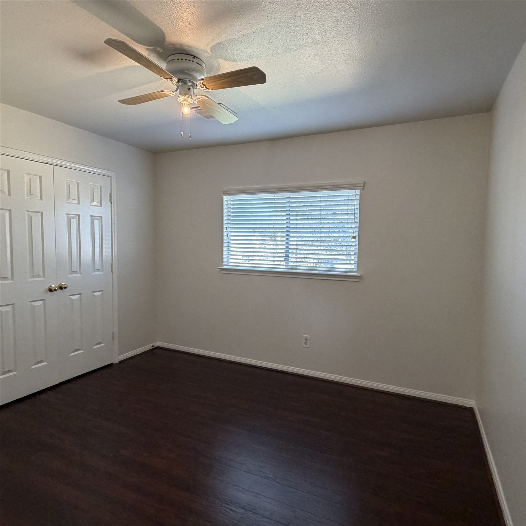 12219 Winderwick Lane Houston, TX 77066 - Photo 30 of 36 a view of a room with wooden floor and a ceiling fan