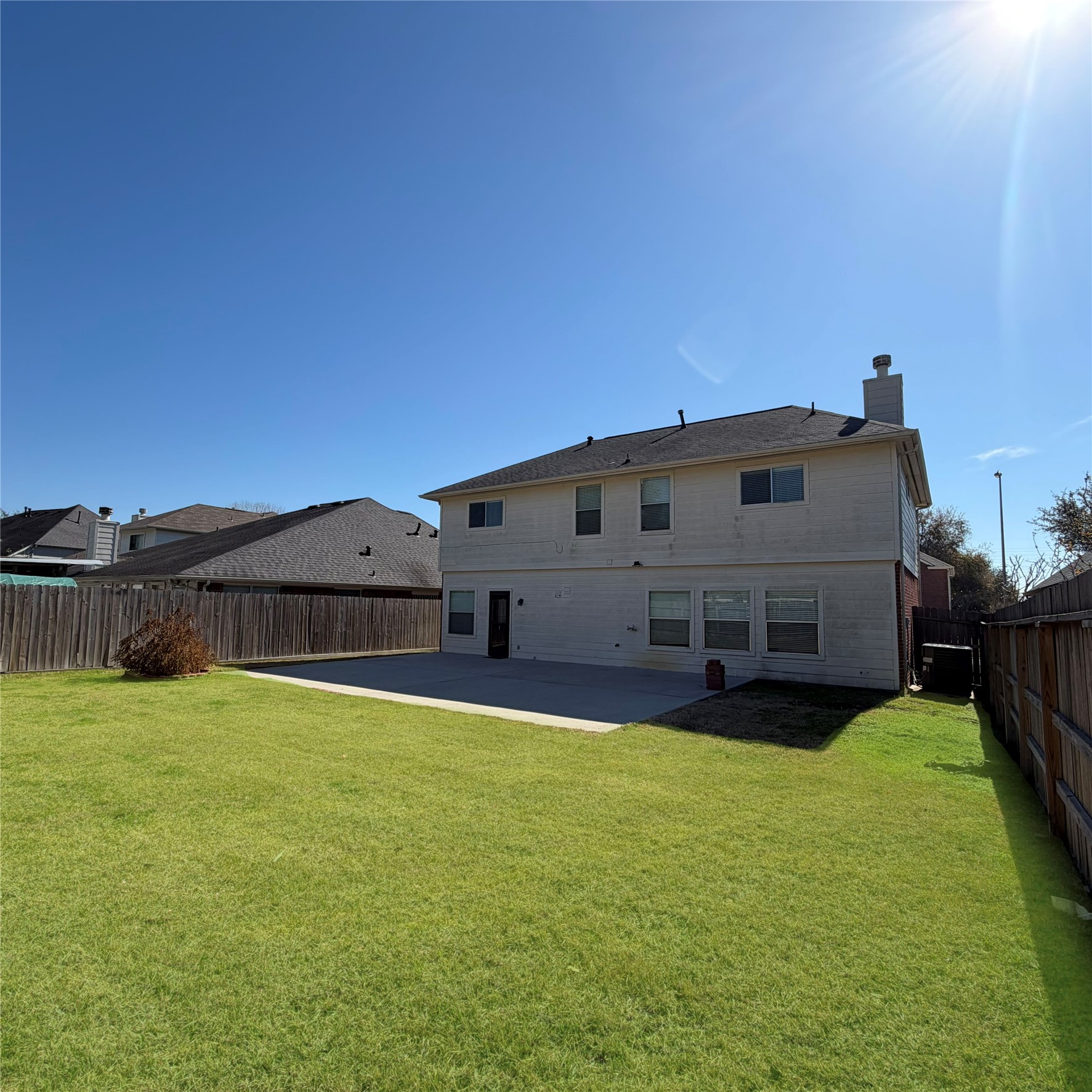 12219 Winderwick Lane Houston, TX 77066 - Photo 35 of 36 a view of a house with a yard and a large tree