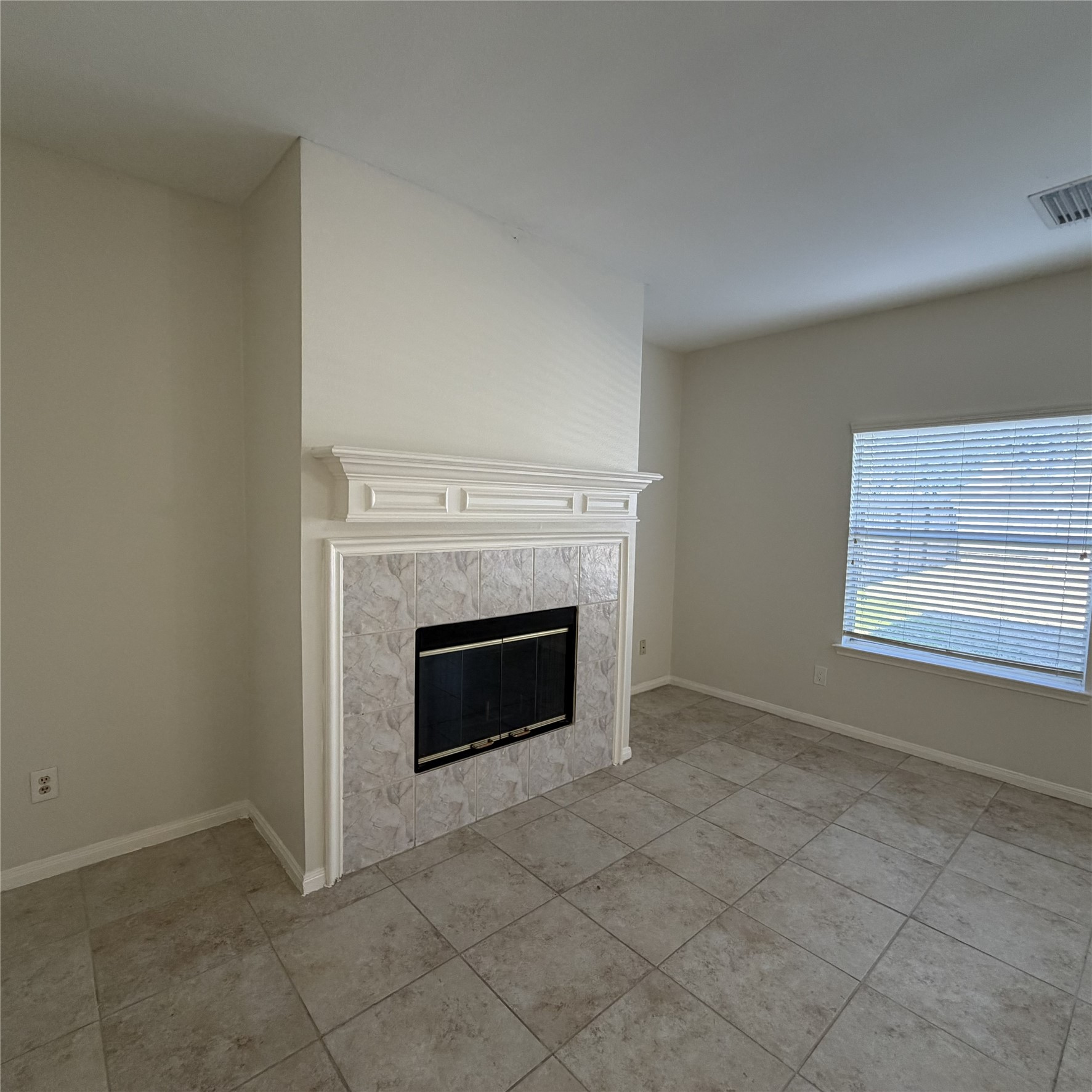 12219 Winderwick Lane Houston, TX 77066 - Photo 10 of 36 a view of an empty room with a window