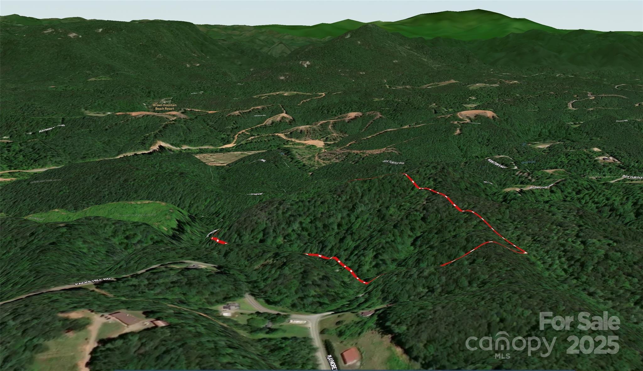 2500 Playmore Beach Road Lenoir, NC 28645 - Photo 11 of 38 a view of a lush green hillside with houses in the background