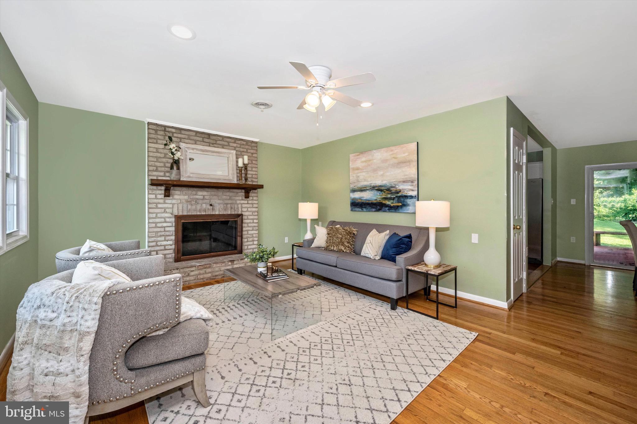 6604 South Clifton Road Frederick, MD 21703 - Photo 3 of 49 Living area with wood burning fireplace