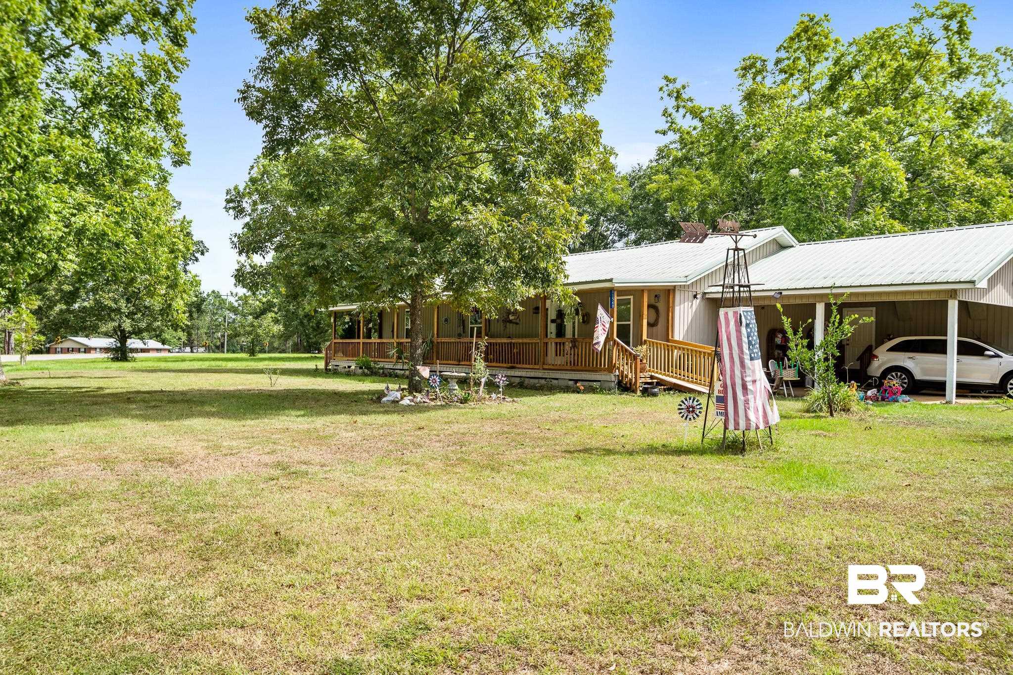 11528 Whitehouse Fork Road Bay Minette, AL 36507 - Photo 2 of 37 View of yard with covered porch