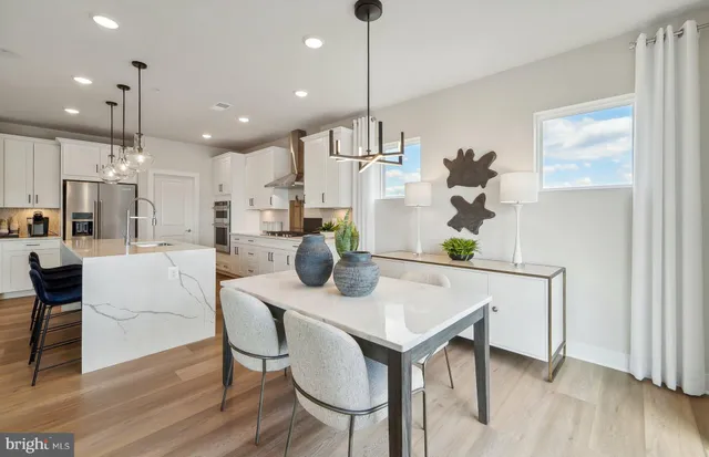 a view of kitchen with cabinets and wooden floor