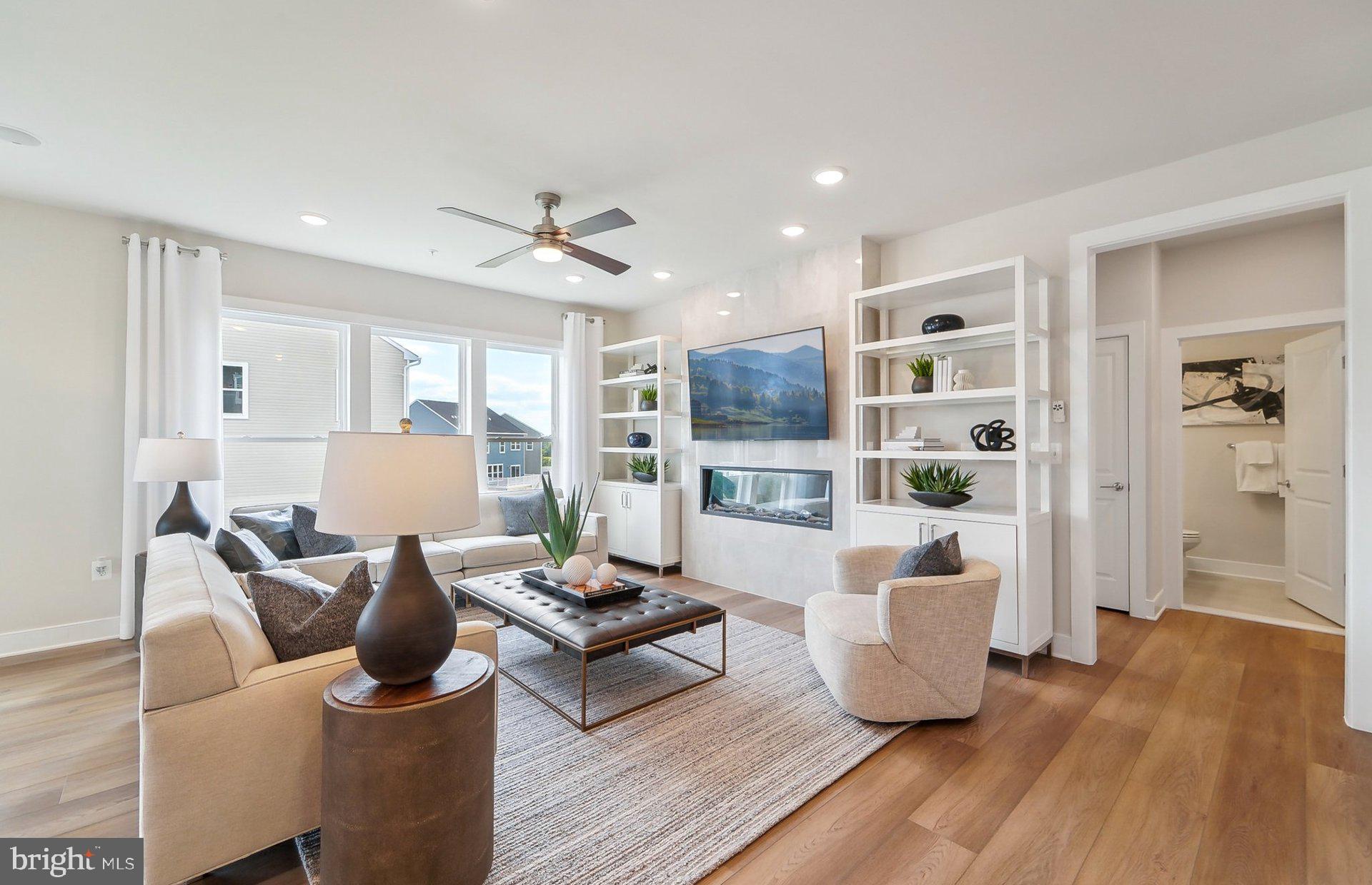 14406 Dowitcher Way Boyds, MD 20841 - Photo 13 of 52 a living room with furniture and a wooden floor
