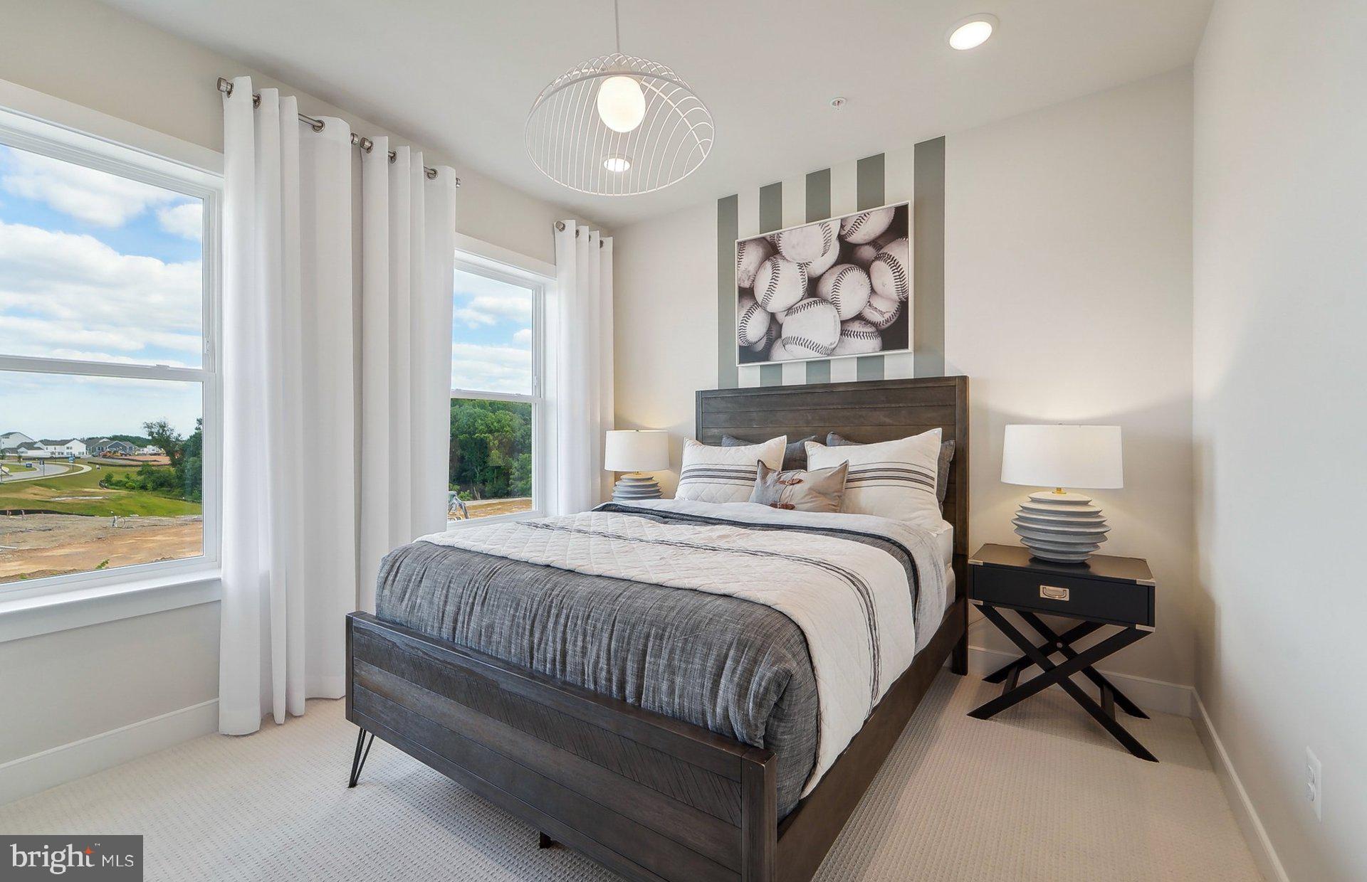 14406 Dowitcher Way Boyds, MD 20841 - Photo 29 of 52 a bedroom with a bed and a window