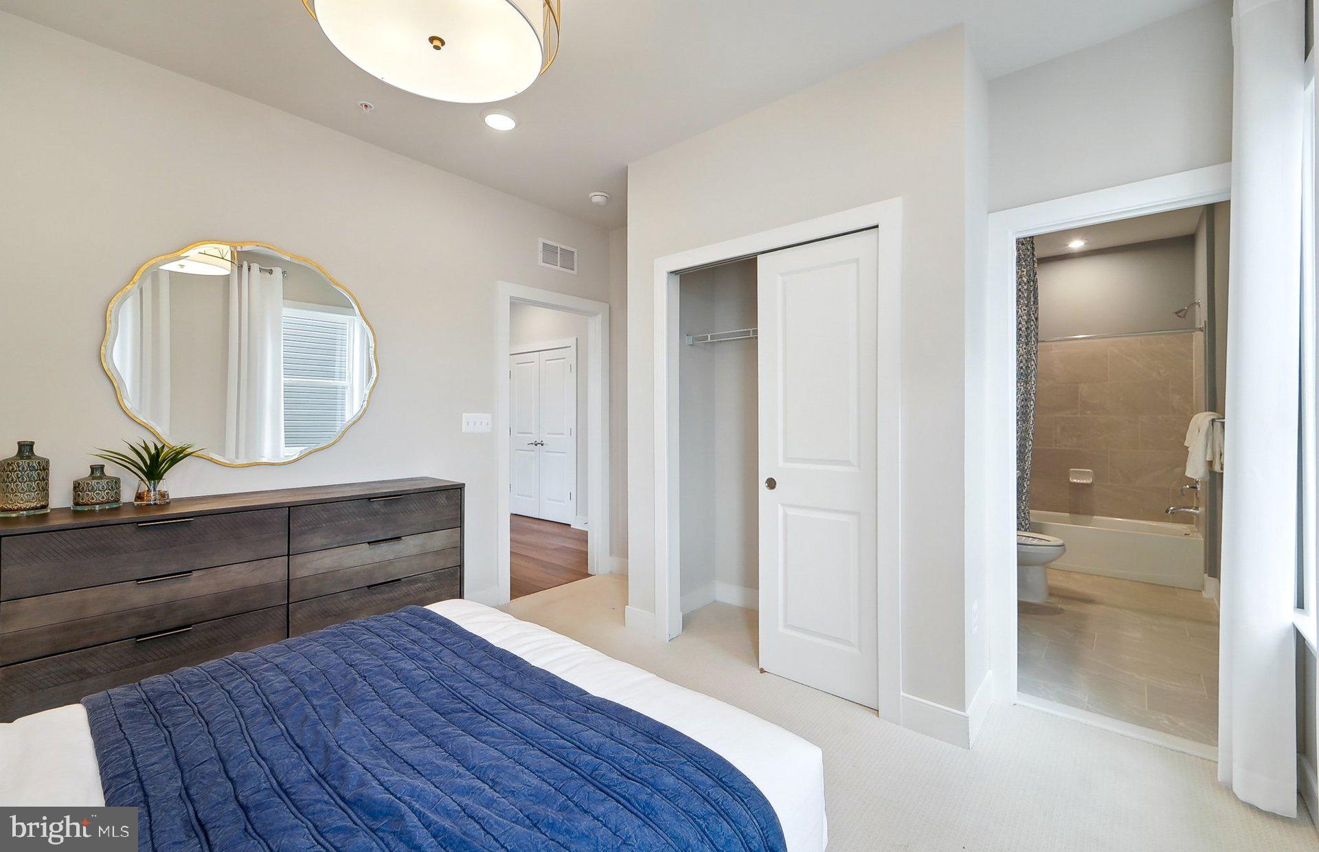 14406 Dowitcher Way Boyds, MD 20841 - Photo 32 of 52 wooden floor with a mirror on dresser and a wooden floor