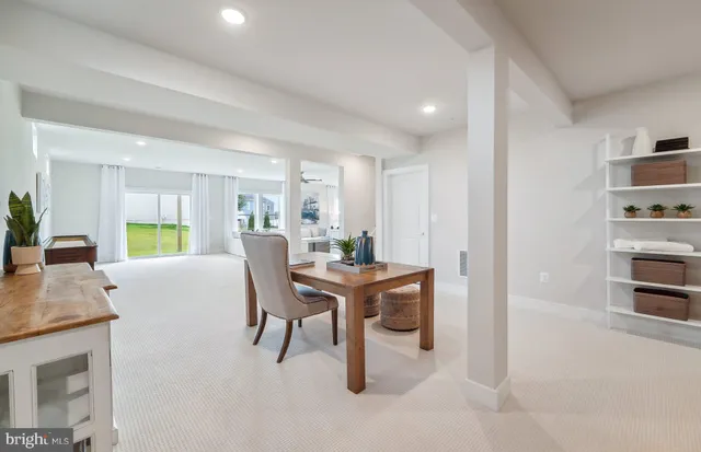 a view of a livingroom with furniture window and wooden floor