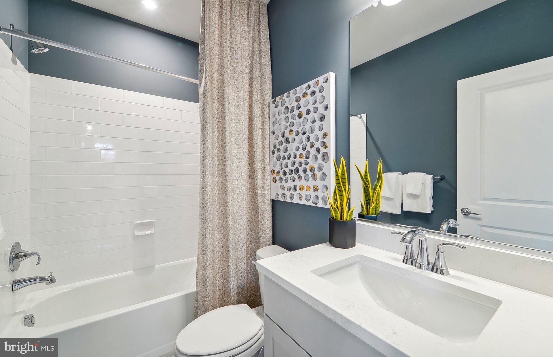 14406 Dowitcher Way Boyds, MD 20841 - Photo 40 of 52 a bathroom with a sink toilet and shower