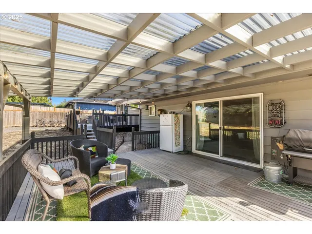 a view of a chairs and table in a patio