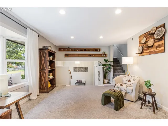 a room with furniture a rug and gym equipment