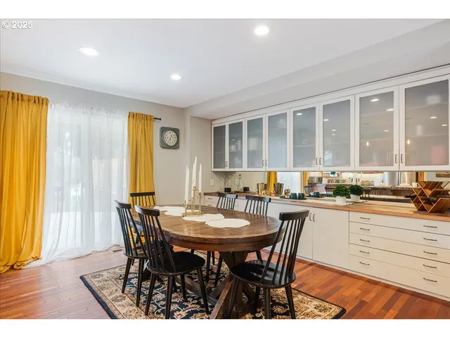 a view of a dining room with furniture and window