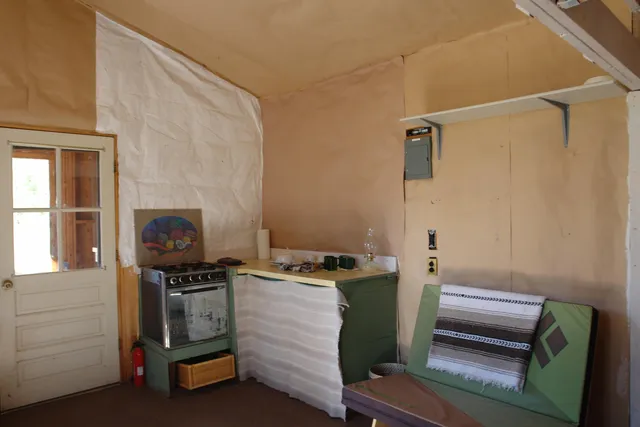 a view of a building with snow on the road